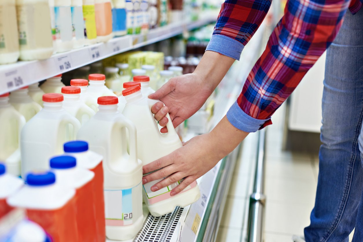 Woman-shopping-milk-in-store